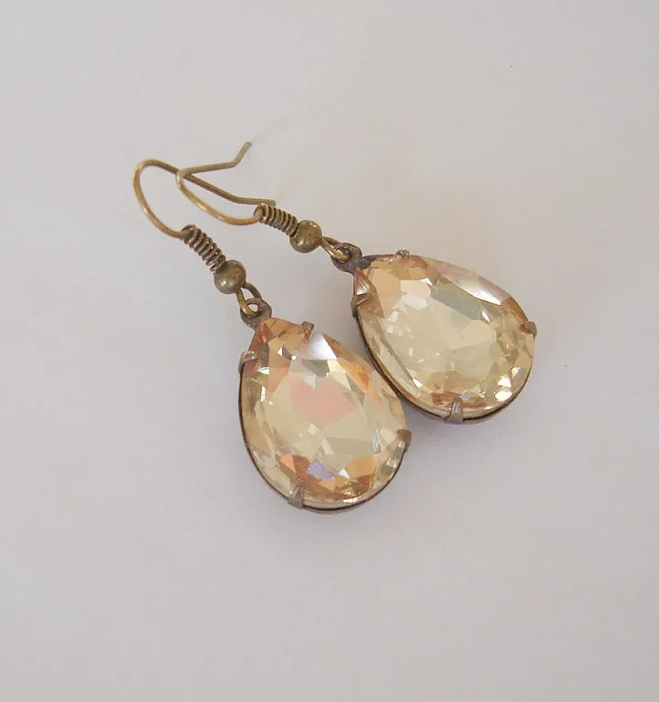 Gold Peach Swarovski Teardrop In Antiqued Brass Prong Settings.