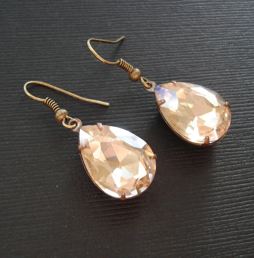 Gold Peach Swarovski Teardrop In Antiqued Brass Prong Settings.
