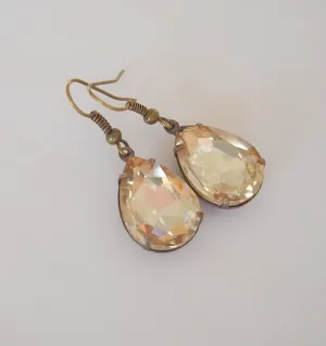 Gold Peach Swarovski Teardrop In Antiqued Brass Prong Settings.