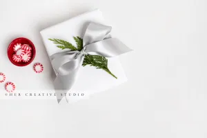 Holiday Gift With Grey Ribbon and Red Candy
