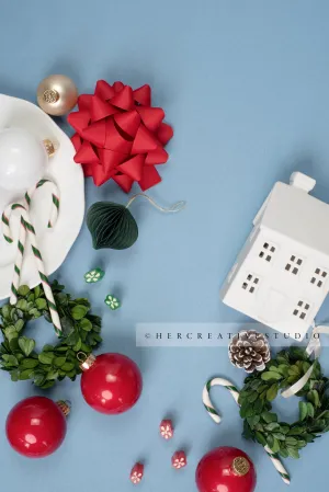 Holiday Home, Red Bow & Ornaments on Sky Blue Background