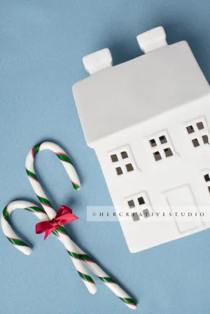 Holiday Home with Candy Canes on Sky Blue Background