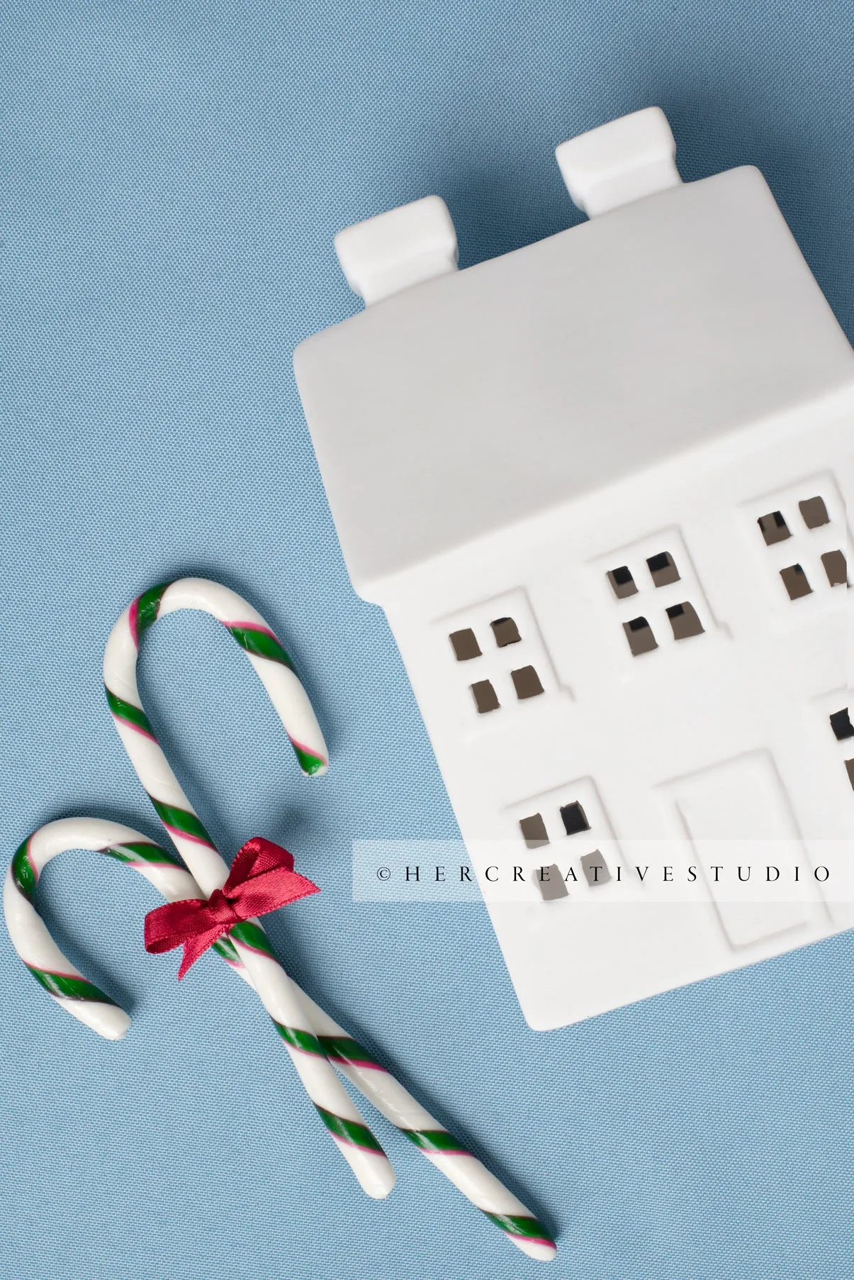 Holiday Home with Candy Canes on Sky Blue Background