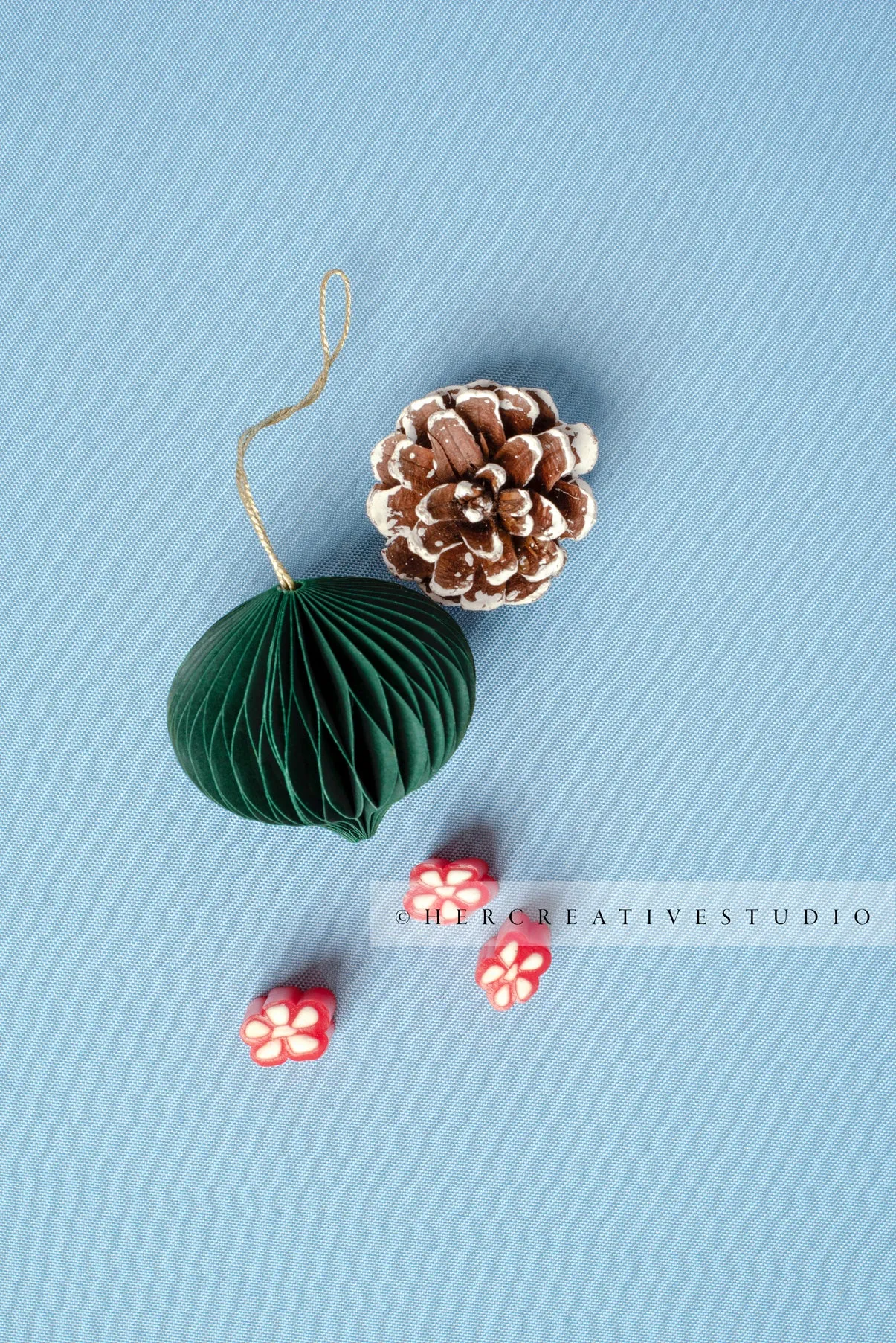 Oranments, Pinecone & Candy on Sky Blue Background