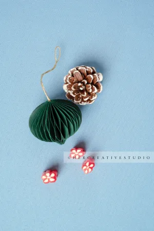 Oranments, Pinecone & Candy on Sky Blue Background