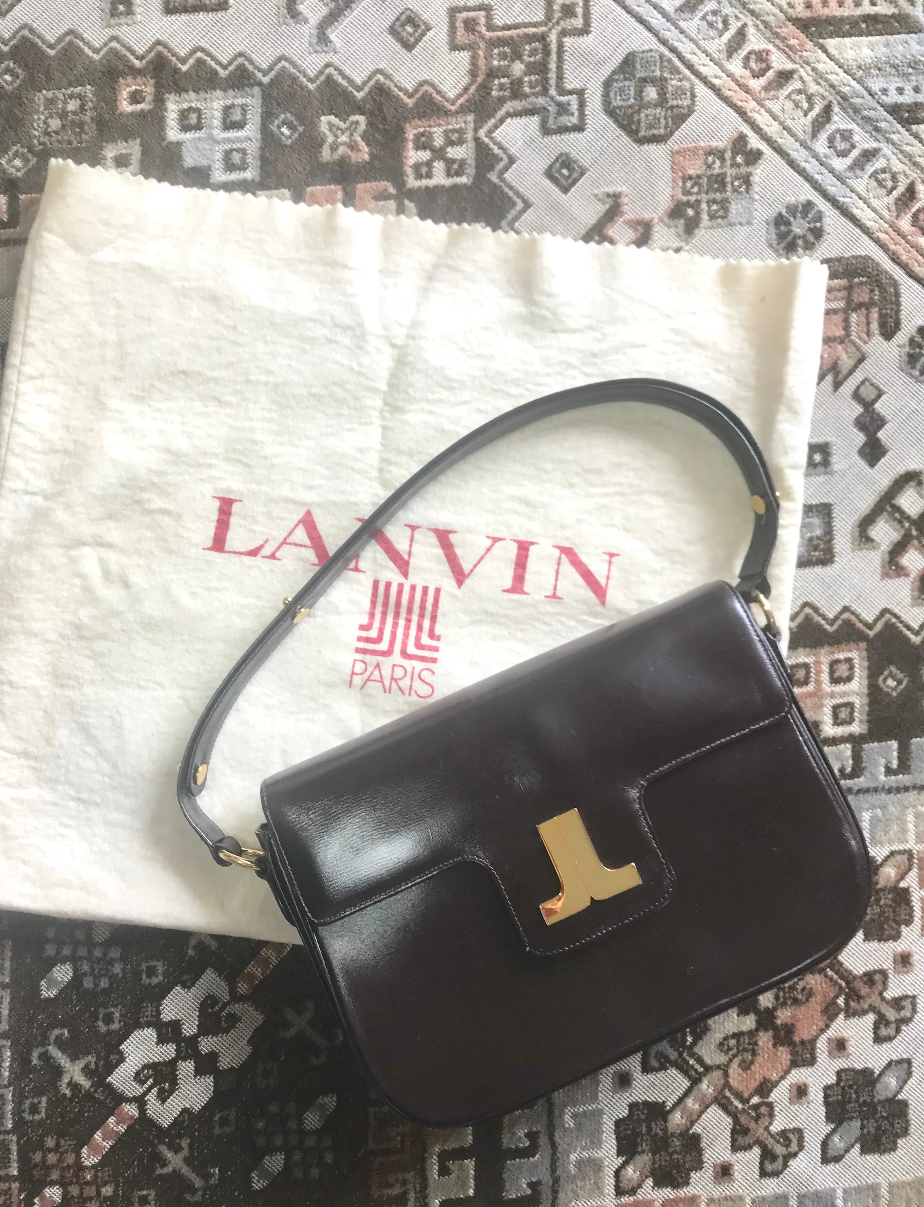 Vintage Lanvin dark brown leather elegant shoulder bag with iconic golden logo motif, Classic purse for daily use. 060620r1
