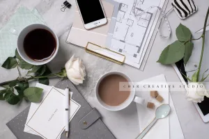 Workspace with coffee and Roses. Stock Image
